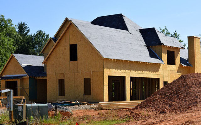 New house with OSB exterior and felt paper on roof