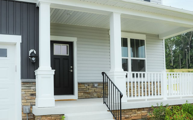 Front of house with blue and white siding