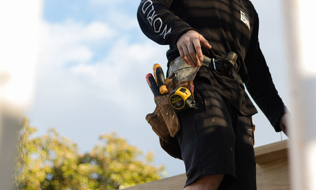 Carpenter with a toll belt