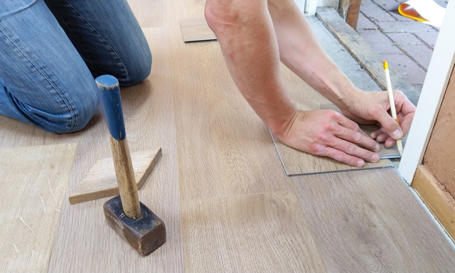 Carpenter installing new flooring